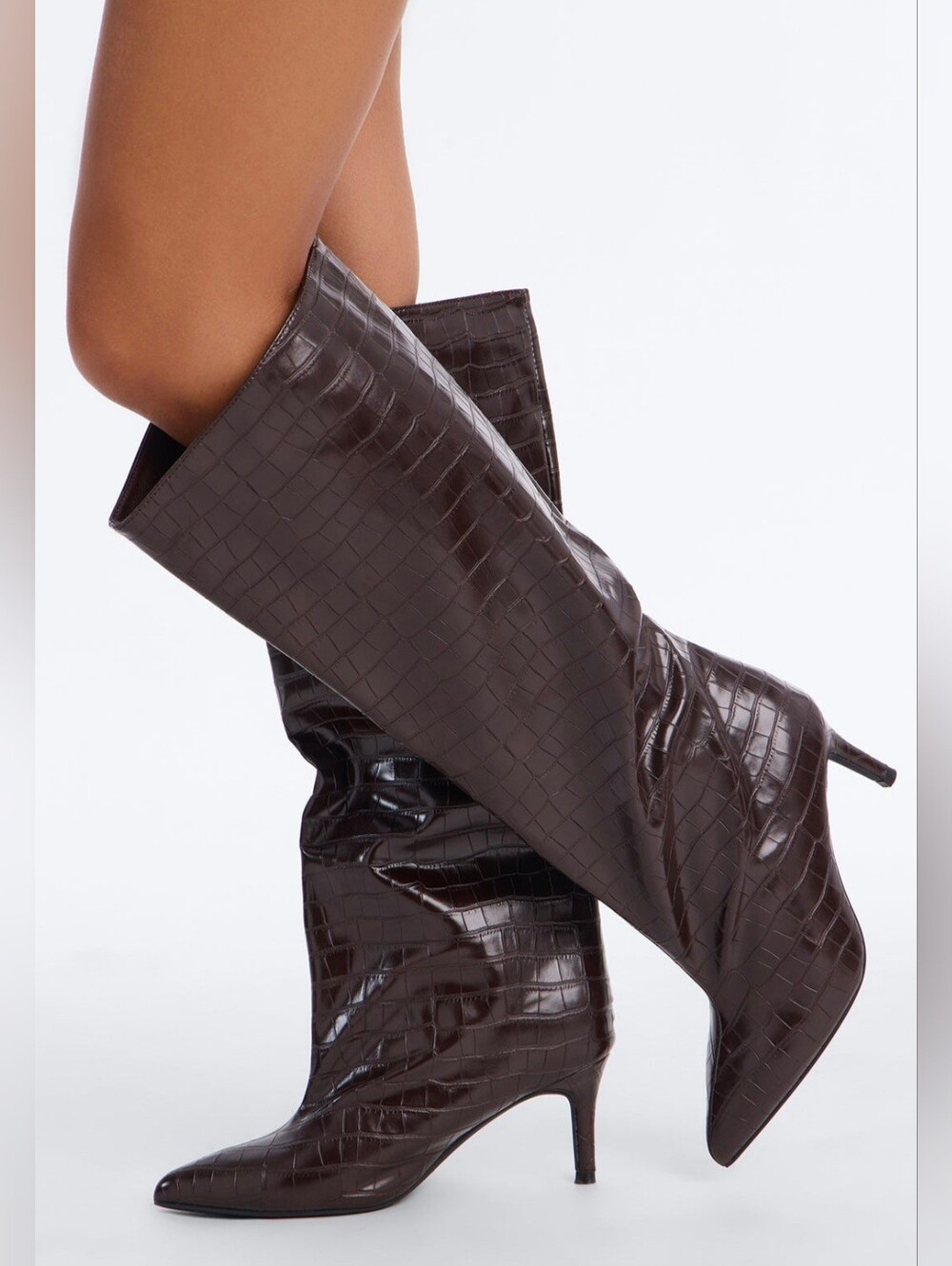 Tall chocolate-colored women's boots with a distinct crocodile-skin texture